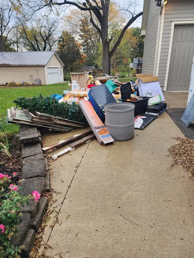 Dumpster being loaded with debris for Residential Dumpster Rental in Carbondale